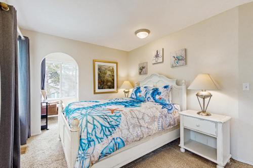 a bedroom with a bed and a window at The Tipsy Kraken in Lincoln City