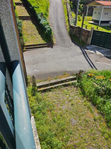 a view of a road from a window of a house at El pisito de iker in Mondariz