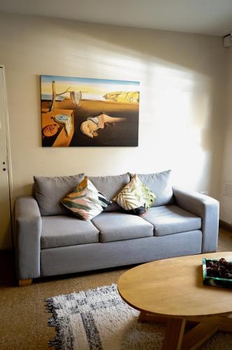 a living room with a couch and a table at GS Hotel in Salta
