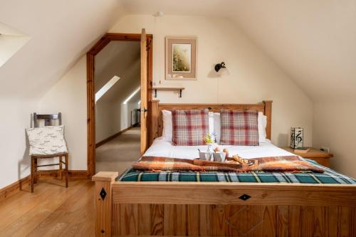 a bedroom with a bed in a attic at Hilltop Farm Holidays in Lincoln