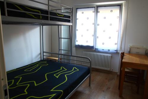 Ένα ή περισσότερα κρεβάτια σε δωμάτιο στο La Conchiglia