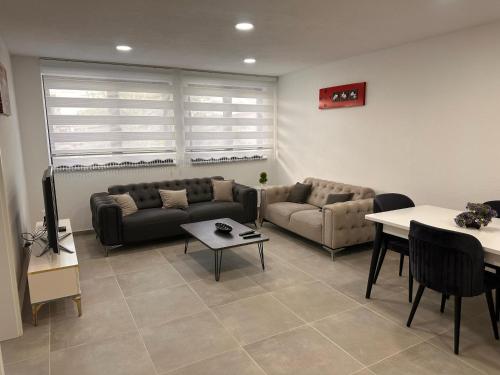 a living room with two couches and a table at Auszeit am Ipf in Bopfingen