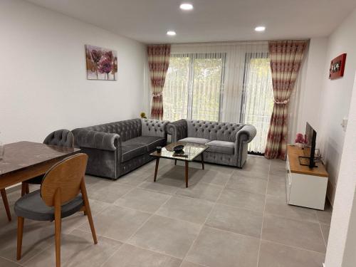 a living room with a couch and a table at Auszeit am Ipf in Bopfingen