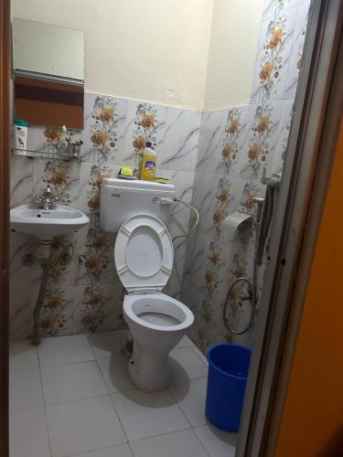 a bathroom with a toilet and a sink at Lake Forest Guest House in Pokhara