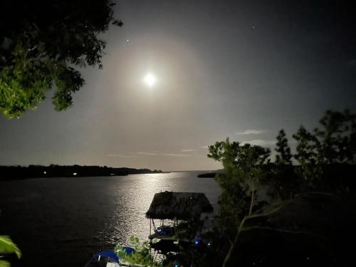 a view of a large body of water at night at SEAHORSE POINT HOTEL and NATURE RESERVE in Bocas del Toro
