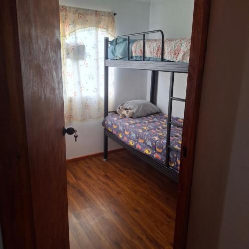 Ένα ή περισσότερα κρεβάτια σε δωμάτιο στο Amplia Casa Familiar huaquen la ligua