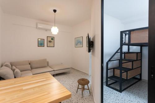 a living room with a couch and a table at Brand new apartment close to the beach Ap 3 in Sarandë