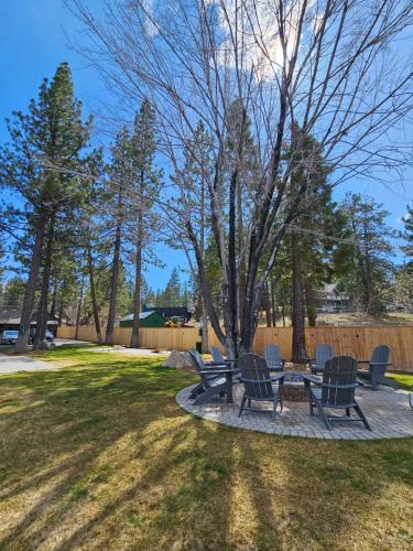 a picnic table and chairs in a park at Big Bear Frontier in Big Bear Lake