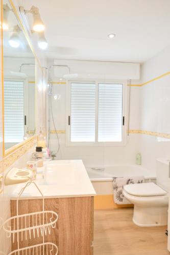 a bathroom with a sink and a toilet at Apartamento Sear Areas in Sanxenxo