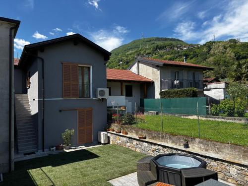 a view of a house with a yard at Casa Mariett Gravedona - Larihome A92 in Gravedona