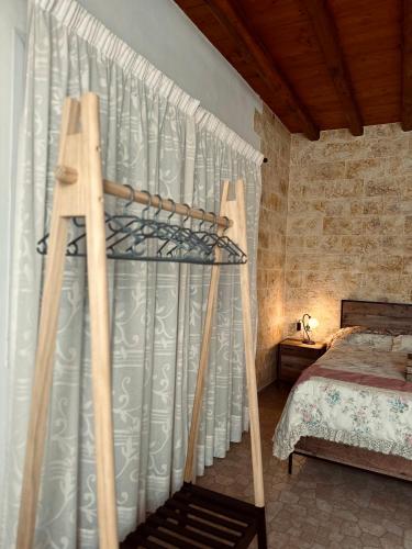 a bedroom with a canopy bed in a room at Home Sweet Home Milos in Triovasálos