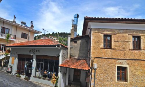 a building on a street next to a store at Camelia Luxury Apt in Kastoria
