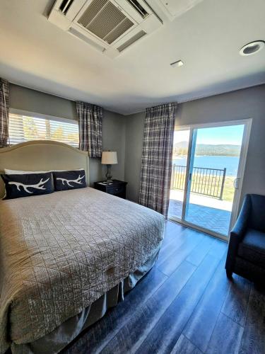 a bedroom with a bed and a view of the ocean at Big Bear Frontier in Big Bear Lake