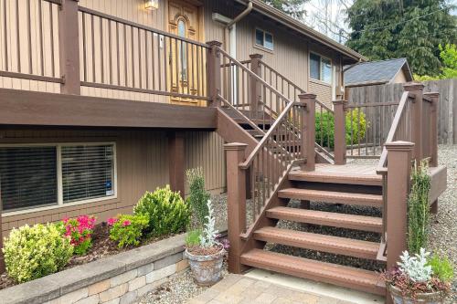 a staircase leading to a house with flowers at City Brilliance in University Place
