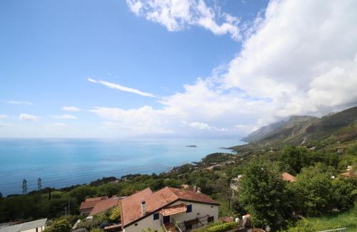 a view of the ocean from a town on a hill at Oltremare in Maratea