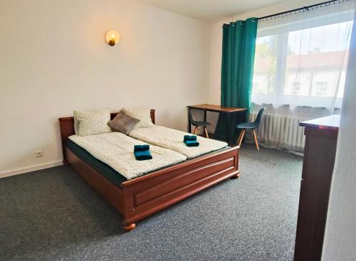 Postel nebo postele na pokoji v ubytování TK Apartamenty I Pokoje