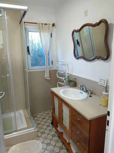 a bathroom with a sink and a shower at Bello atardecer Uribe in Uribelarrea