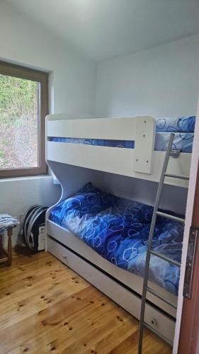 a bedroom with two bunk beds in a room at Panorama in Plav