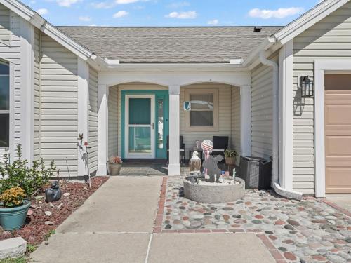 a house with a fountain in the front yard at 704 Z2B VILLAGE OF RIO GRANDE by REMAX Premier in The Villages