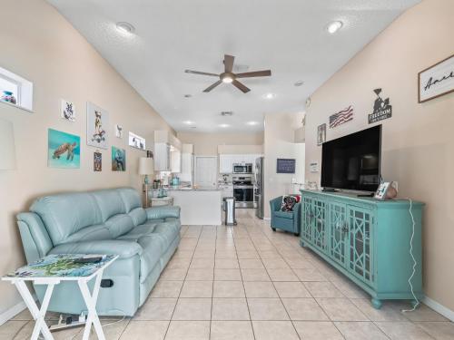 a living room with a couch and a tv at 704 Z2B VILLAGE OF RIO GRANDE by REMAX Premier in The Villages