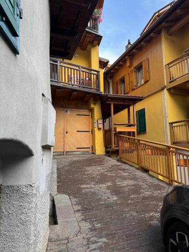 a building with two garage doors and a driveway at Caorer in Predazzo