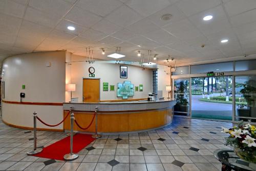 a lobby of a hospital with a waiting area at Holiday Inn - Bulawayo by IHG in Bulawayo