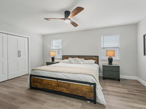 a white bedroom with a bed and a ceiling fan at 962 Z2B VILLAGE OF EL CORTEZ by REMAX Premier in Lady Lake