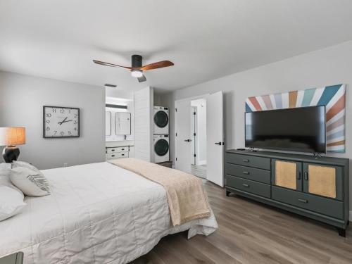 a bedroom with a bed and a flat screen tv at 962 Z2B VILLAGE OF EL CORTEZ by REMAX Premier in Lady Lake