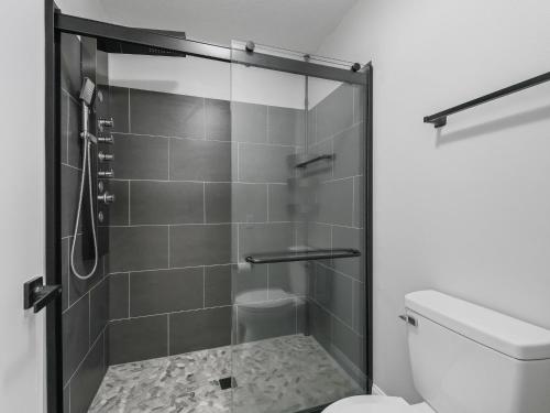 a bathroom with a shower and a toilet at 962 Z2B VILLAGE OF EL CORTEZ by REMAX Premier in Lady Lake