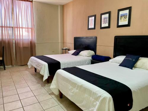 Cama o camas de una habitación en Hotel Marney Aguascalientes