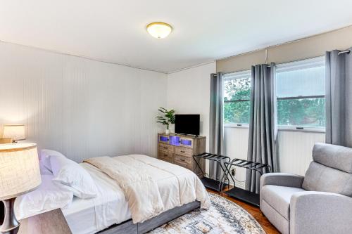 a bedroom with a bed and a couch and a chair at Hersheypark 6 Mi Away Family Getaway with Fire Pit in Palmyra