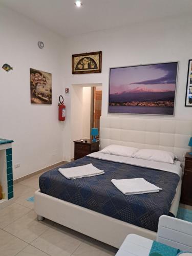 Posteľ alebo postele v izbe v ubytovaní ortigia adriana suite