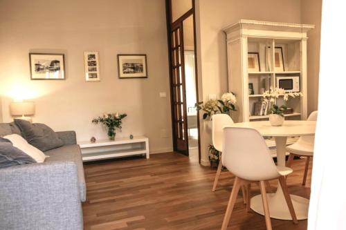 a living room with a couch and a table at Casa Bebella in Senigallia