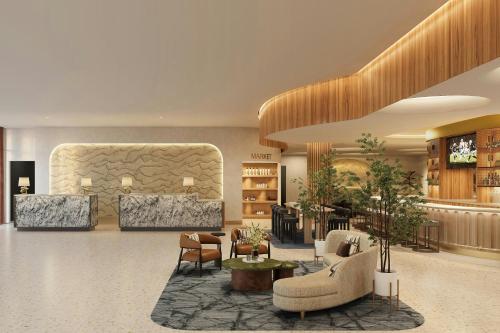 a lobby with couches and chairs and a table at The Westin Galleria Dallas in Dallas