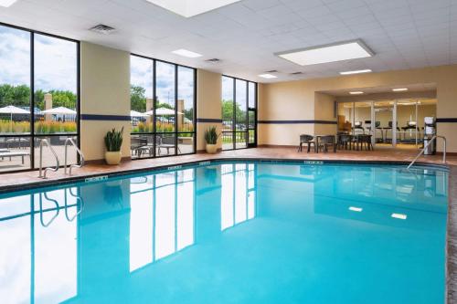 a pool with blue water in a hotel room at Sheraton West Des Moines in West Des Moines