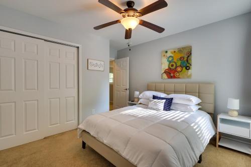 a bedroom with a white bed with a ceiling fan at Lexington Nest - 3 Bedrooms and 2 and Half Baths in Lexington