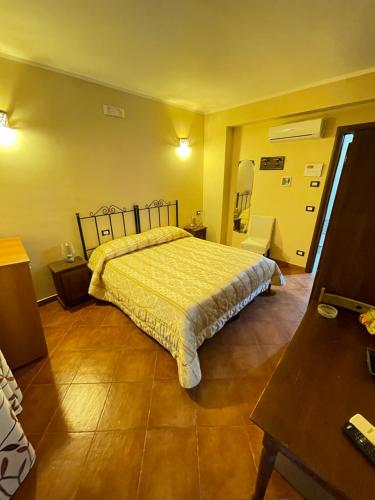 a bedroom with a large bed in a room at B&B San Domenico in Realmonte