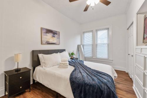 a bedroom with a bed and a ceiling fan at Steps 2 High ST - BIG Patio - Private parking- OSU in Milo