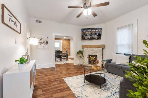 a living room with a couch and a fireplace at Steps 2 High ST - BIG Patio - Private parking- OSU in Milo