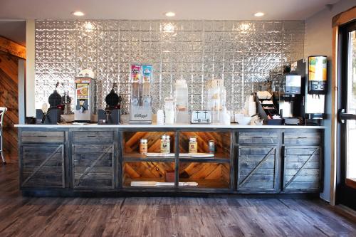 a counter in a coffee shop with a counter at Sunlac Inn Devils Lake in Devils Lake