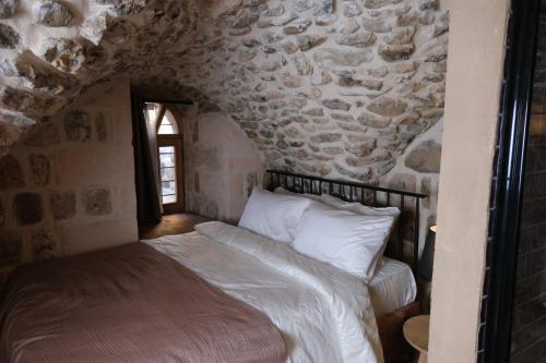 Postel nebo postele na pokoji v ubytování Kaia House