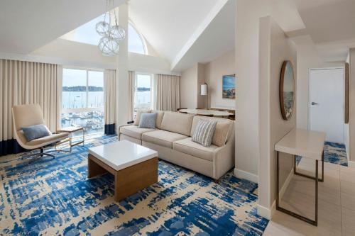 a living room with a couch and a table at Newport Marriott Hotel & Spa in Newport