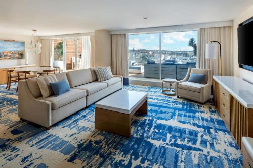 a living room with a couch and a table at Newport Marriott Hotel & Spa in Newport