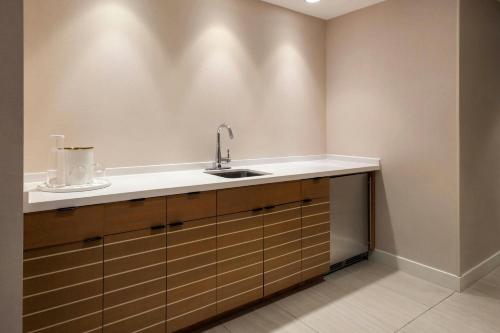 a kitchen with a sink and a counter at Newport Marriott Hotel & Spa in Newport