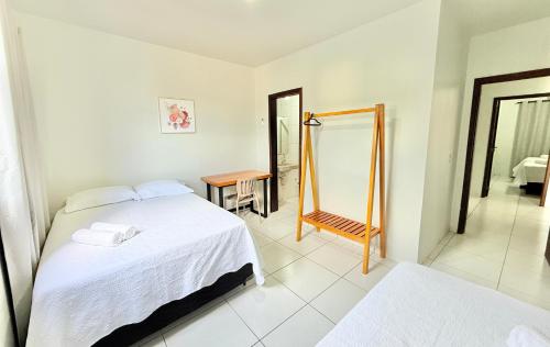 Ein Bett oder Betten in einem Zimmer der Unterkunft Ap Conforto no Centro de Sinop