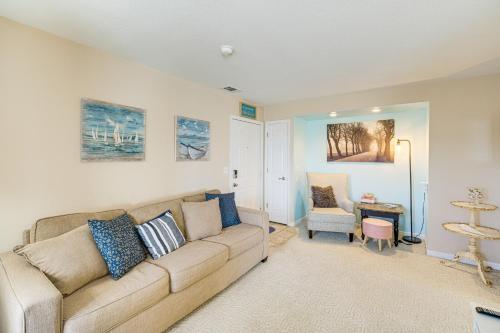 a living room with a couch and a chair at 1 Mi to Ferry Port Clinton Condo with Beach View! in Port Clinton