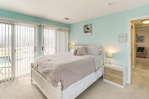 a bedroom with a white bed and a window at 1 Mi to Ferry Port Clinton Condo with Beach View! in Port Clinton