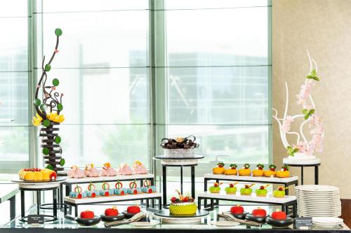 a buffet with many different types of food on display at Radisson Blu Hotel, Dubai Media City in Dubai