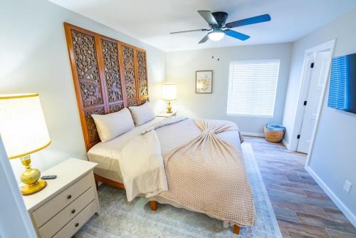 a bedroom with a bed and a ceiling fan at Marcs Red Rock Retreat 2 Primary Suites 2 Bath in Sedona