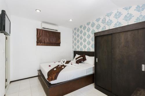 Una cama o camas en una habitación de Samui Pier Beach Front & Resort
